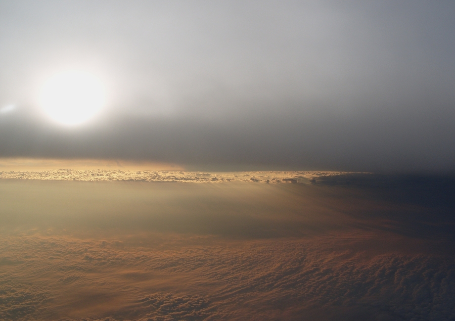 The sun and clouds in the afternoon from cruising altitude